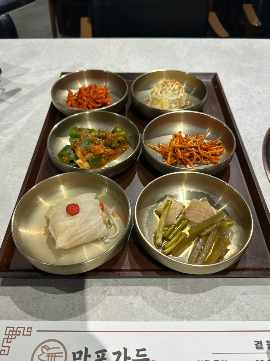 Table spread with Manpo Garden's basic side dishes