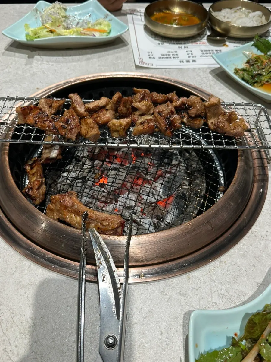 Seasoned galbi cooking to a golden brown