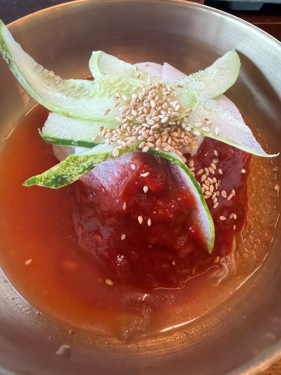 Sign for free house-made Hamhung naengmyeon with galbi order
