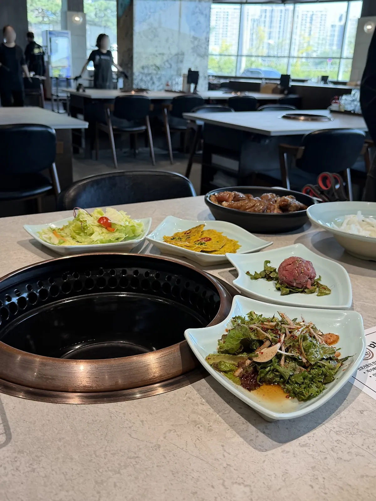 Table set with Manpo Garden's 11 side dishes