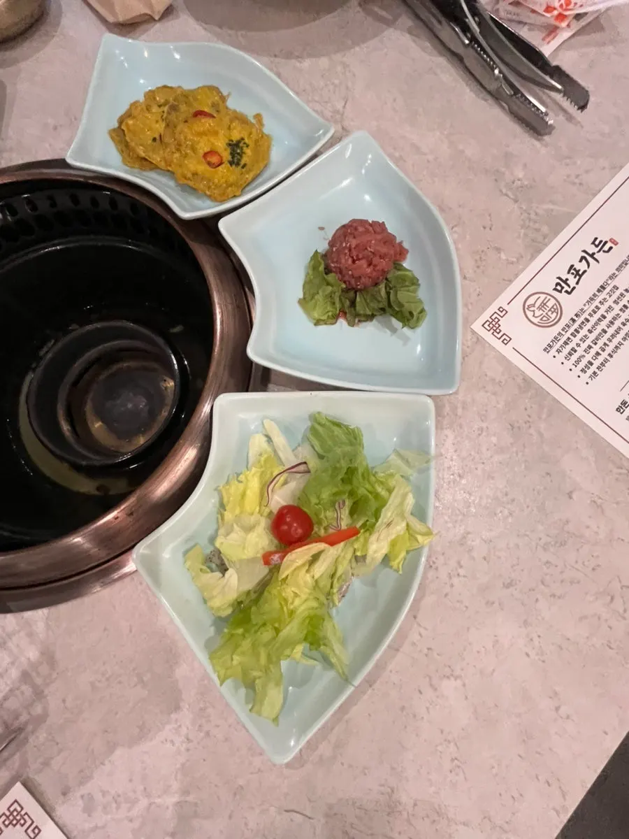 Plate of potato salad and baek-kimchi side dishes