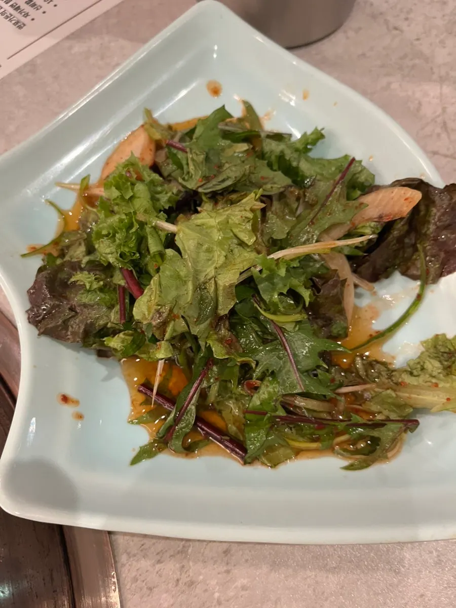 Grilled pork galbi eaten with pickled onions