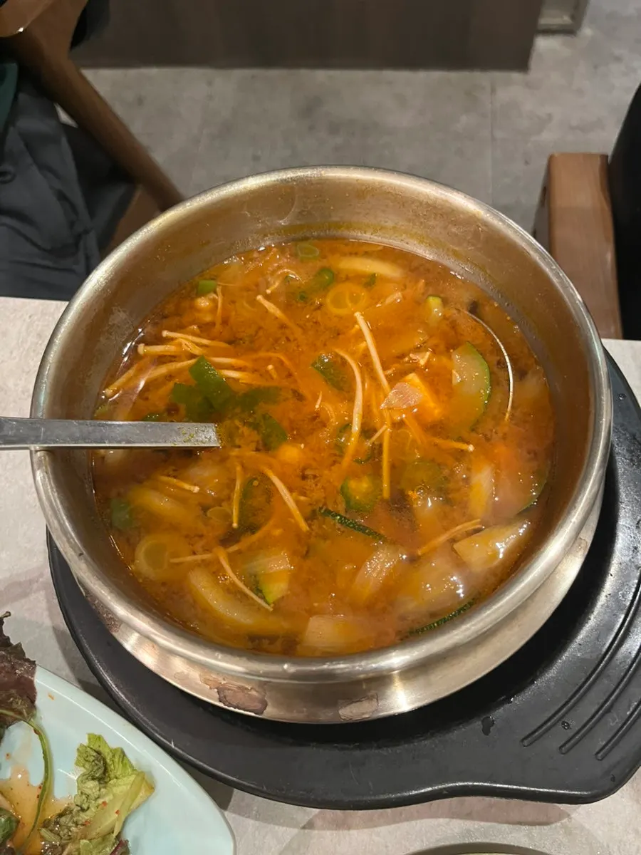 Table setting with steamed egg and chadol dwenjang jjigae