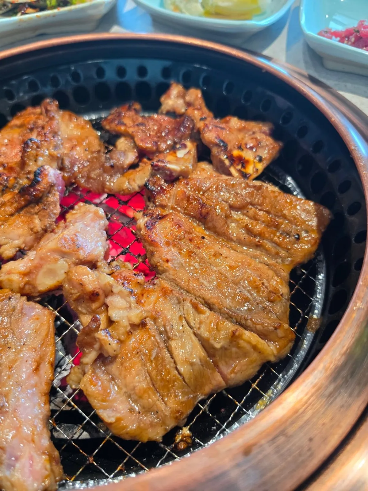 Manpo Garden's handmade galbi cooking over charcoal