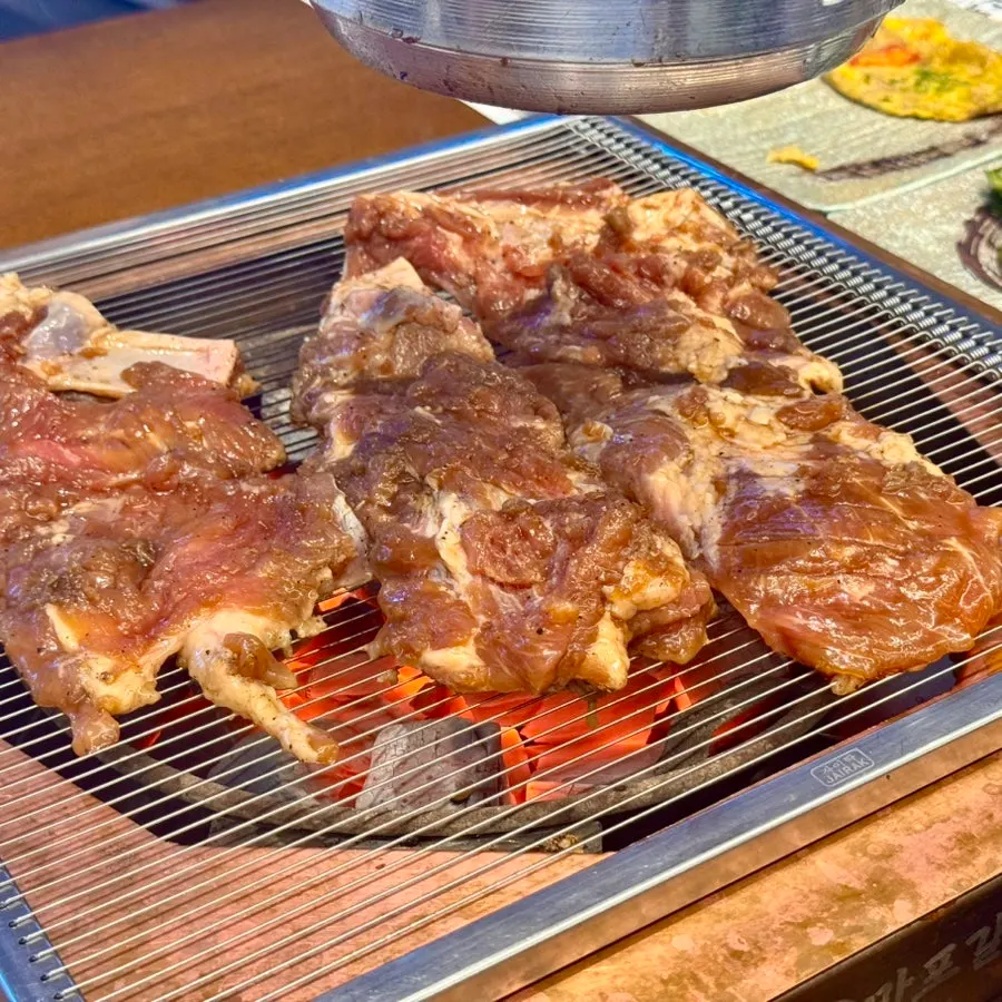 Handmade Korean pork ribs over charcoal