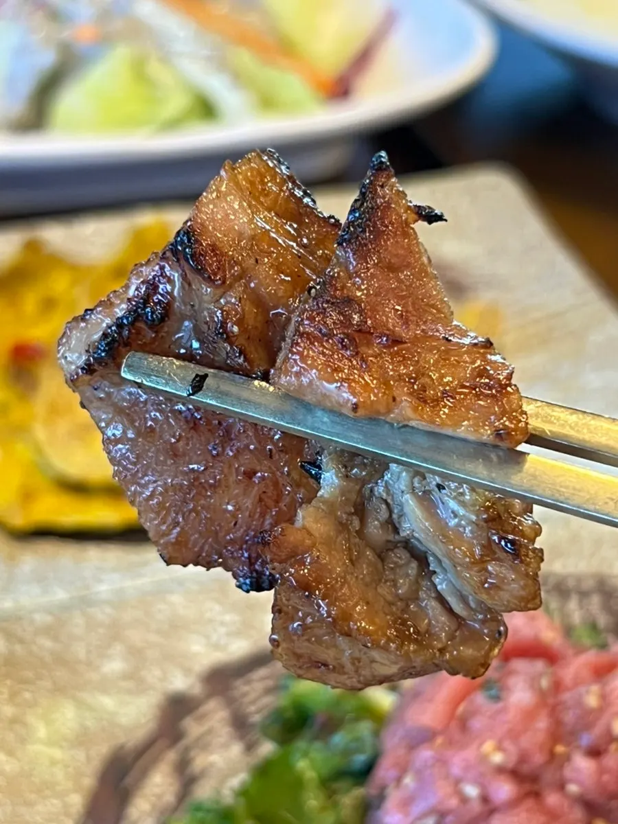 Galbi turning golden brown on the grill