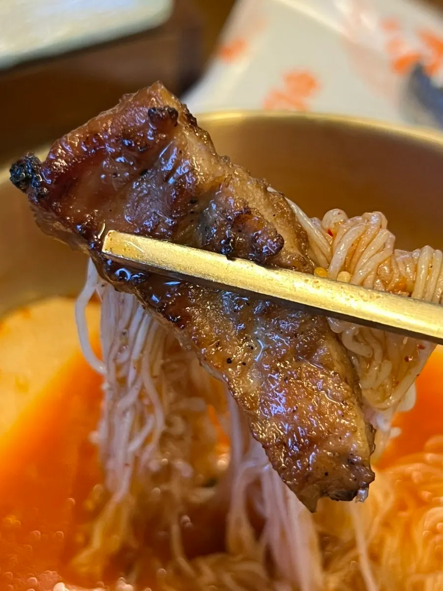Bibim naengmyeon topped with yukhoe and galbi