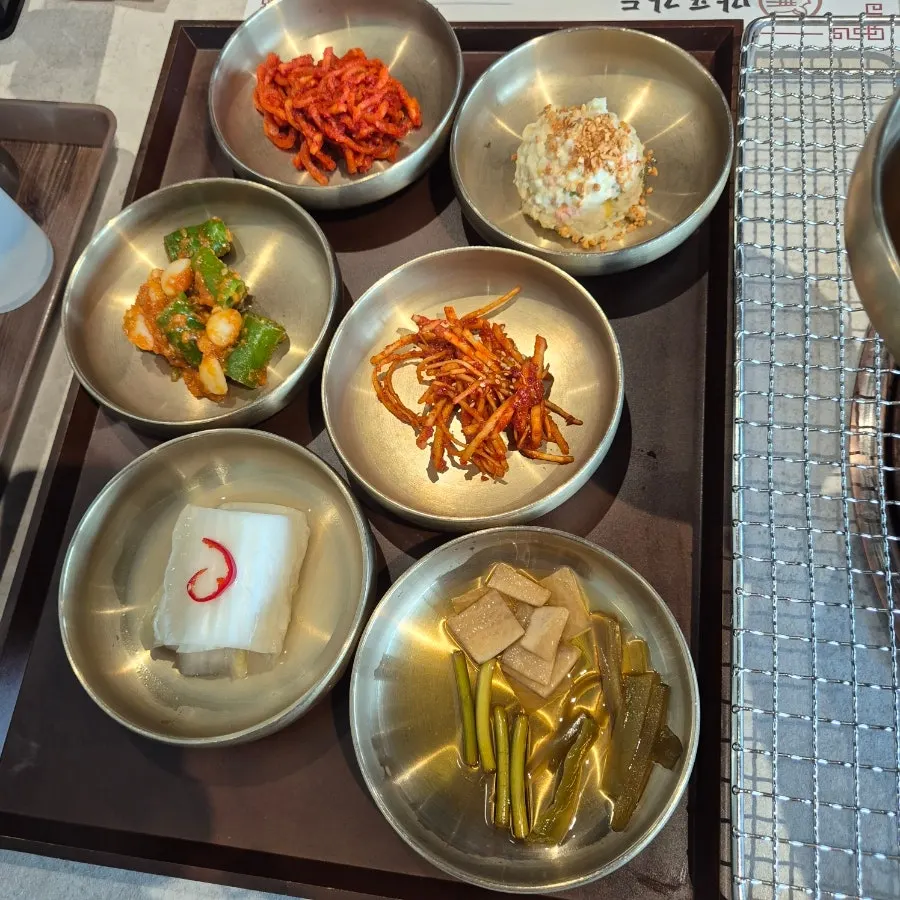 Full table spread of side dishes and meat