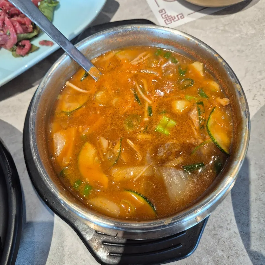 Marinated galbi cooking over charcoal