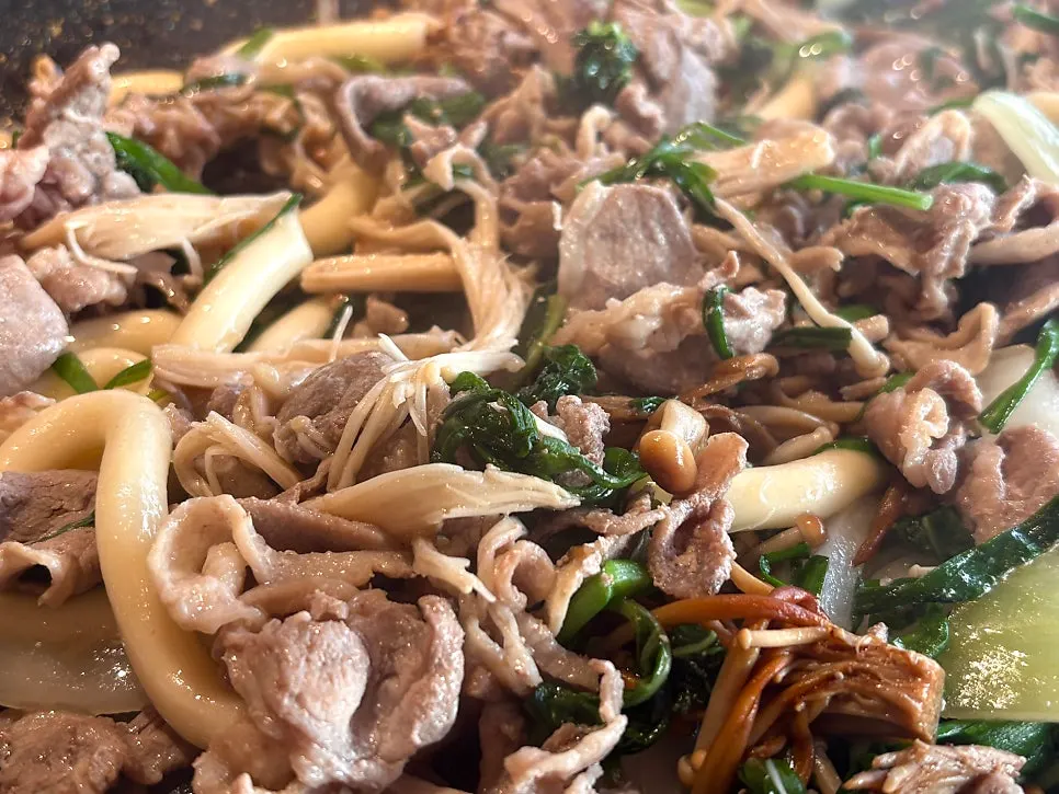 Duck flower bulgogi cooking on the grill