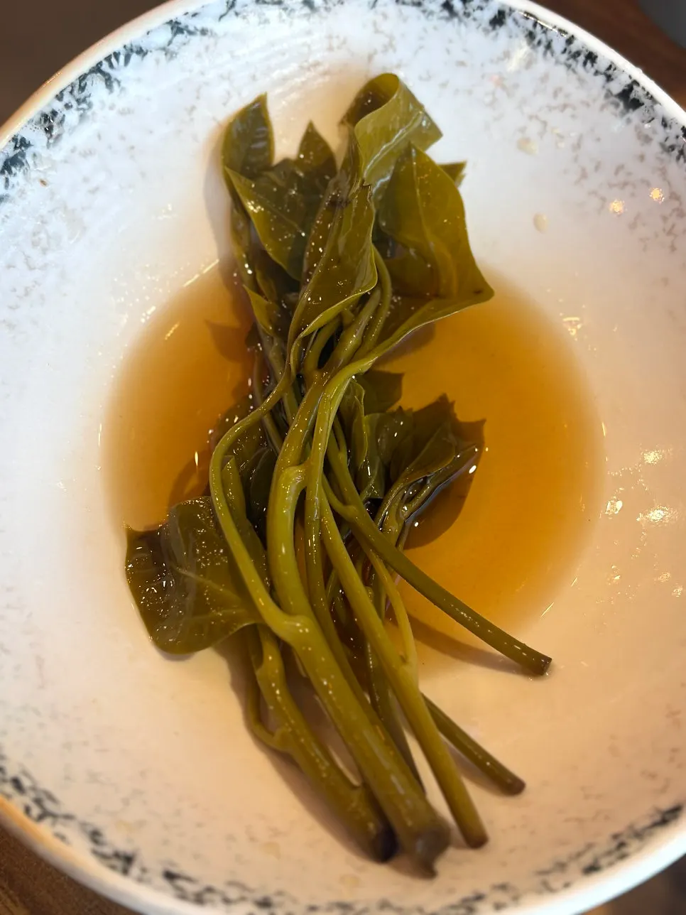 A piece of duck bulgogi placed on wrap greens