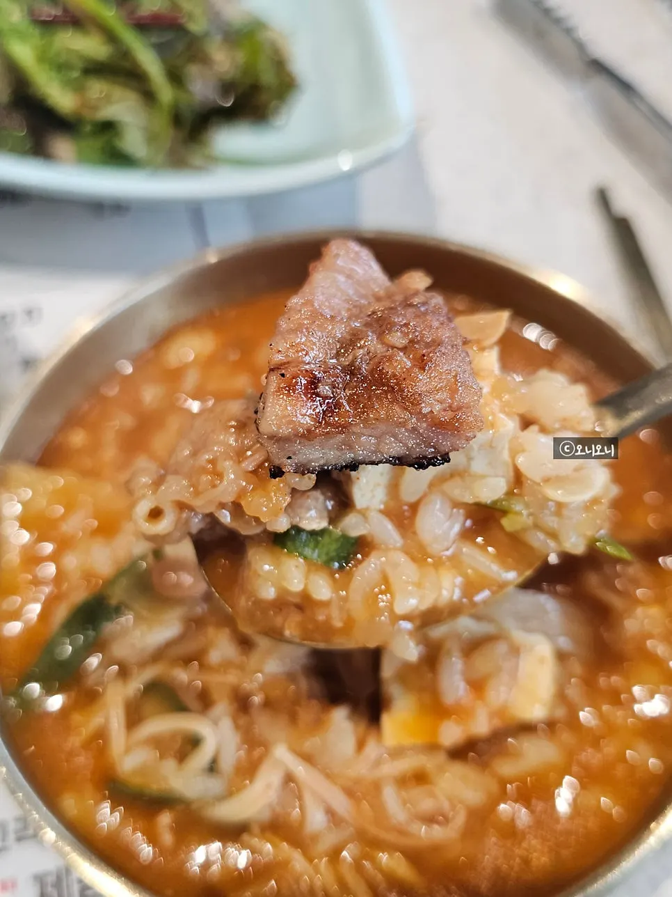 A spread of doenjang sulbap served alongside pork galbi