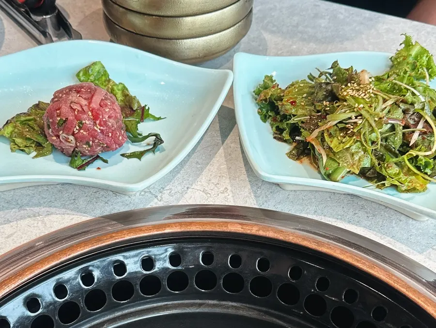 Table setting with side dishes and salad