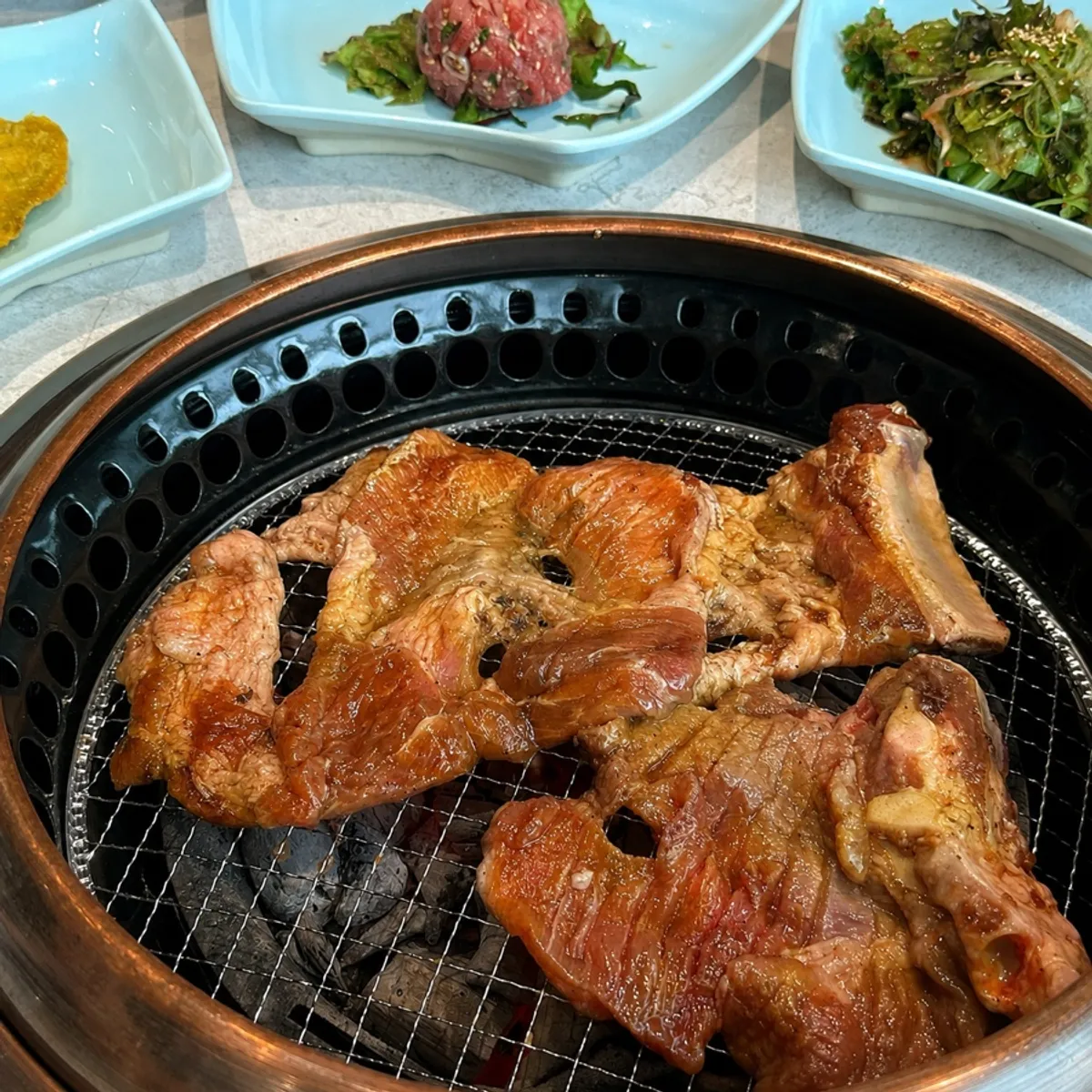 Close-up of pork galbi lightly grilled on the outside
