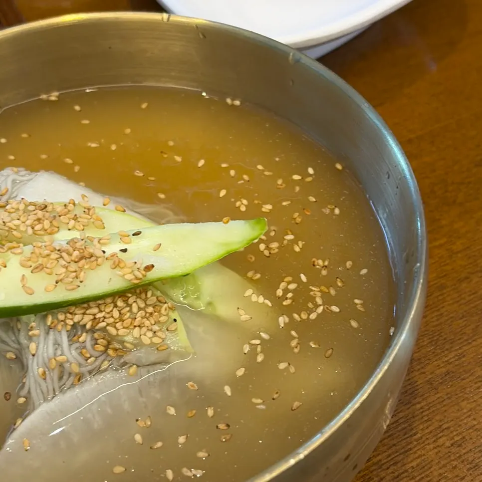 Table with naengmyeon and steamed egg added