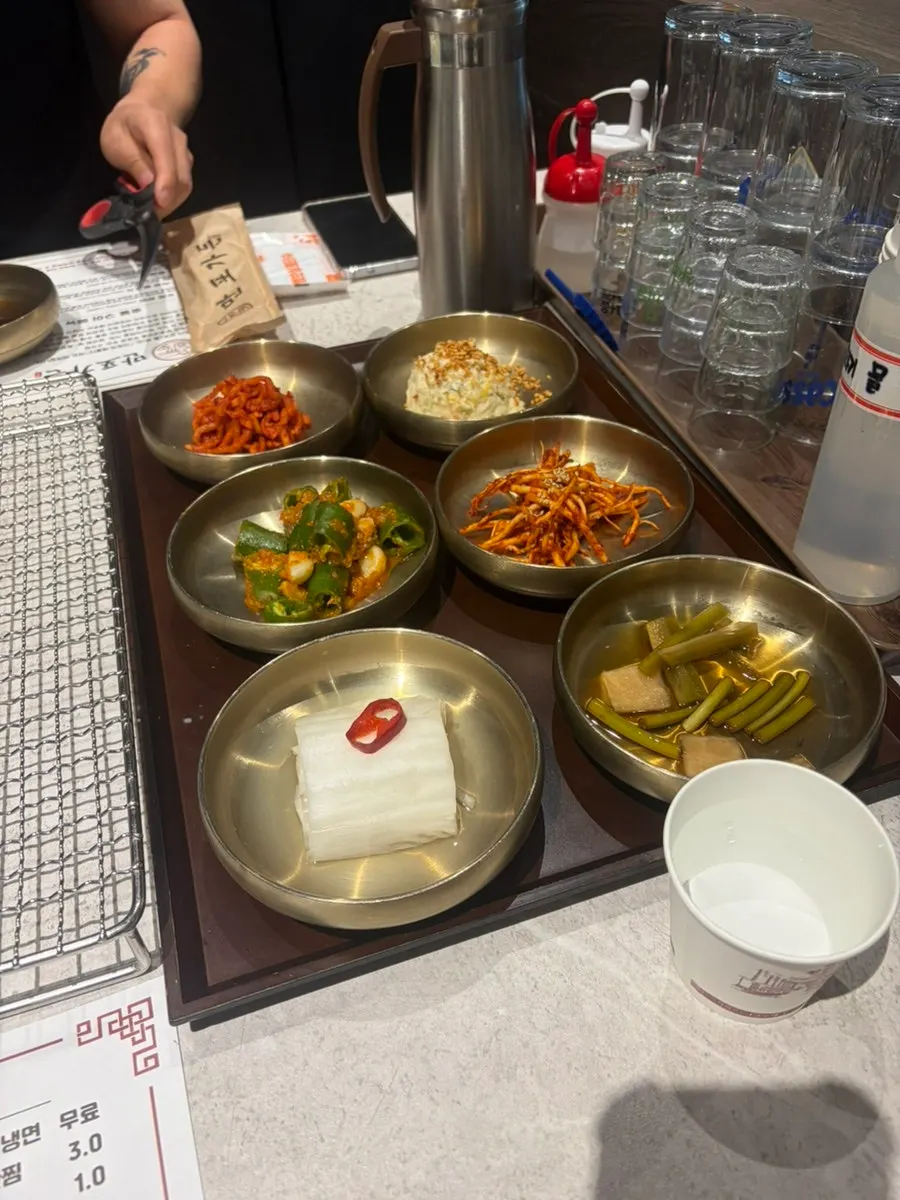 Self-service corner with kimchi and water kimchi