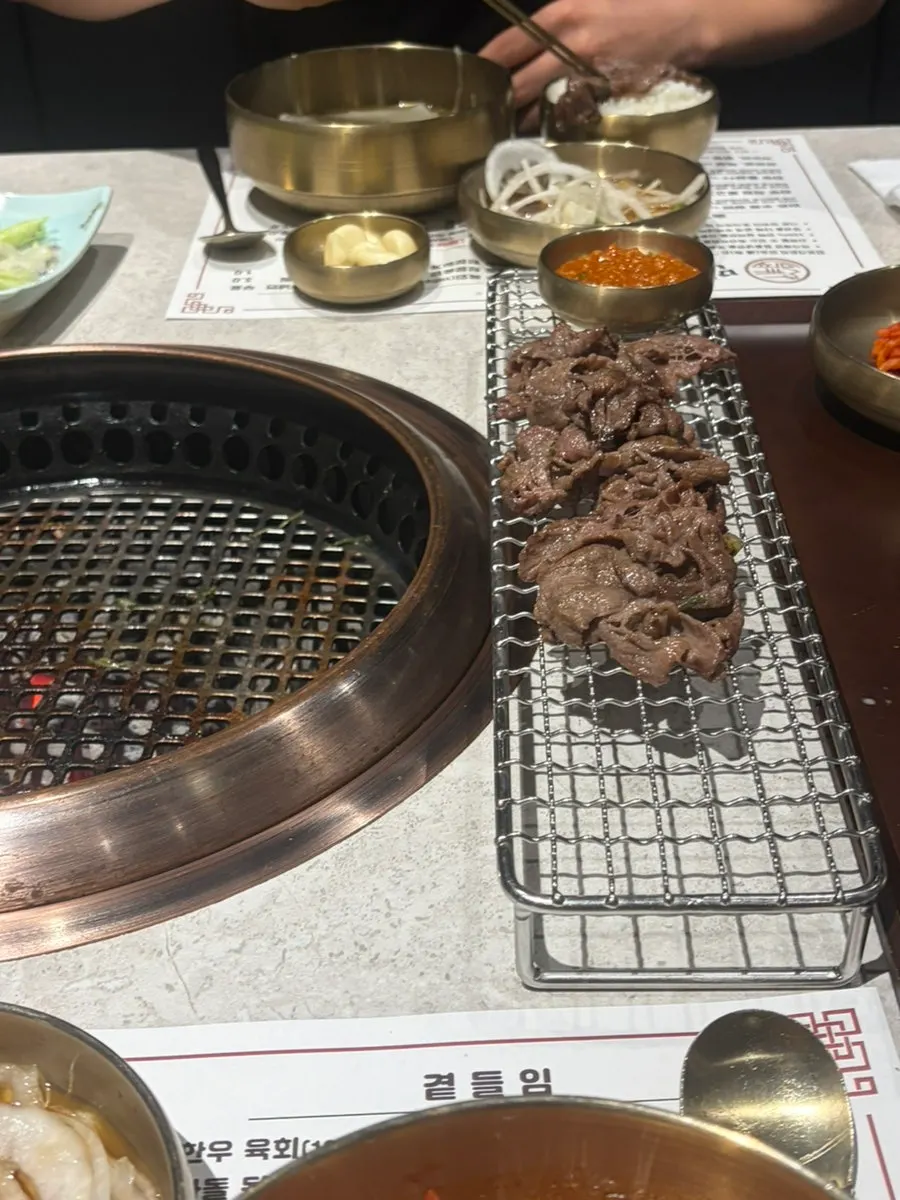 Charcoal hanwoo bulgogi grilling on the pan
