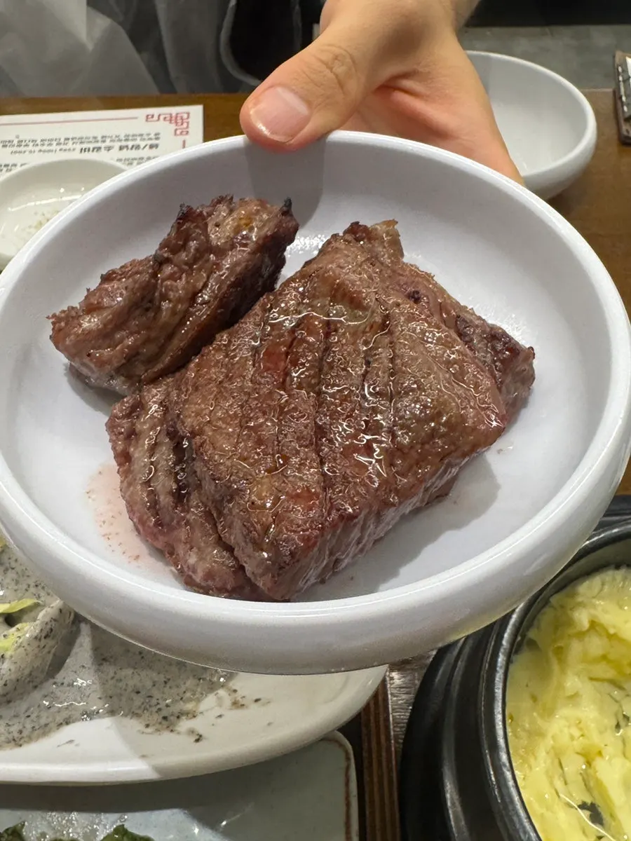 Plate of raw beef short ribs showing marbling