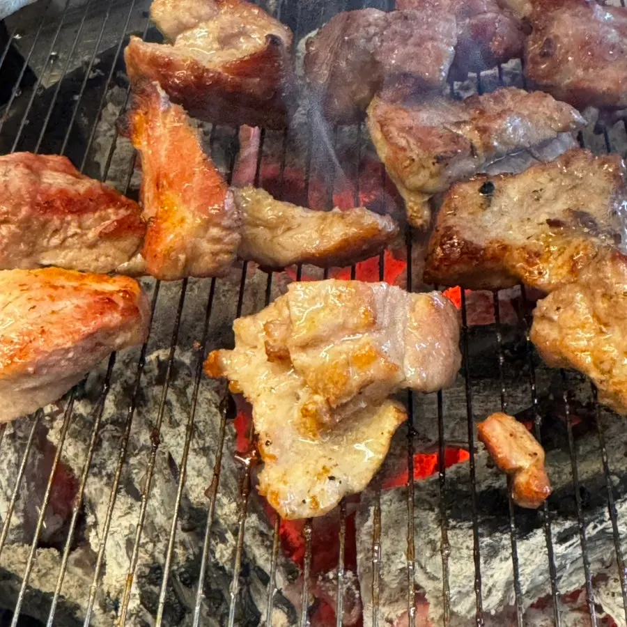 A piece of raw galbi grilled golden brown