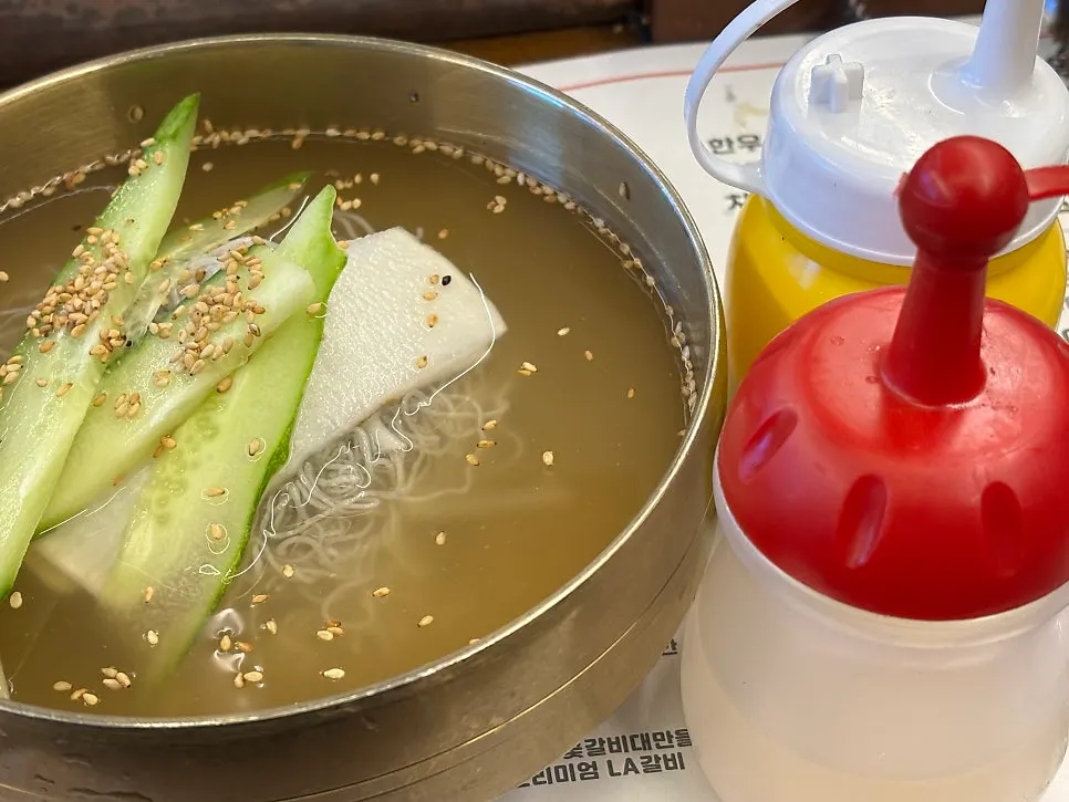 Well-cooked galbi served with a bowl of rice