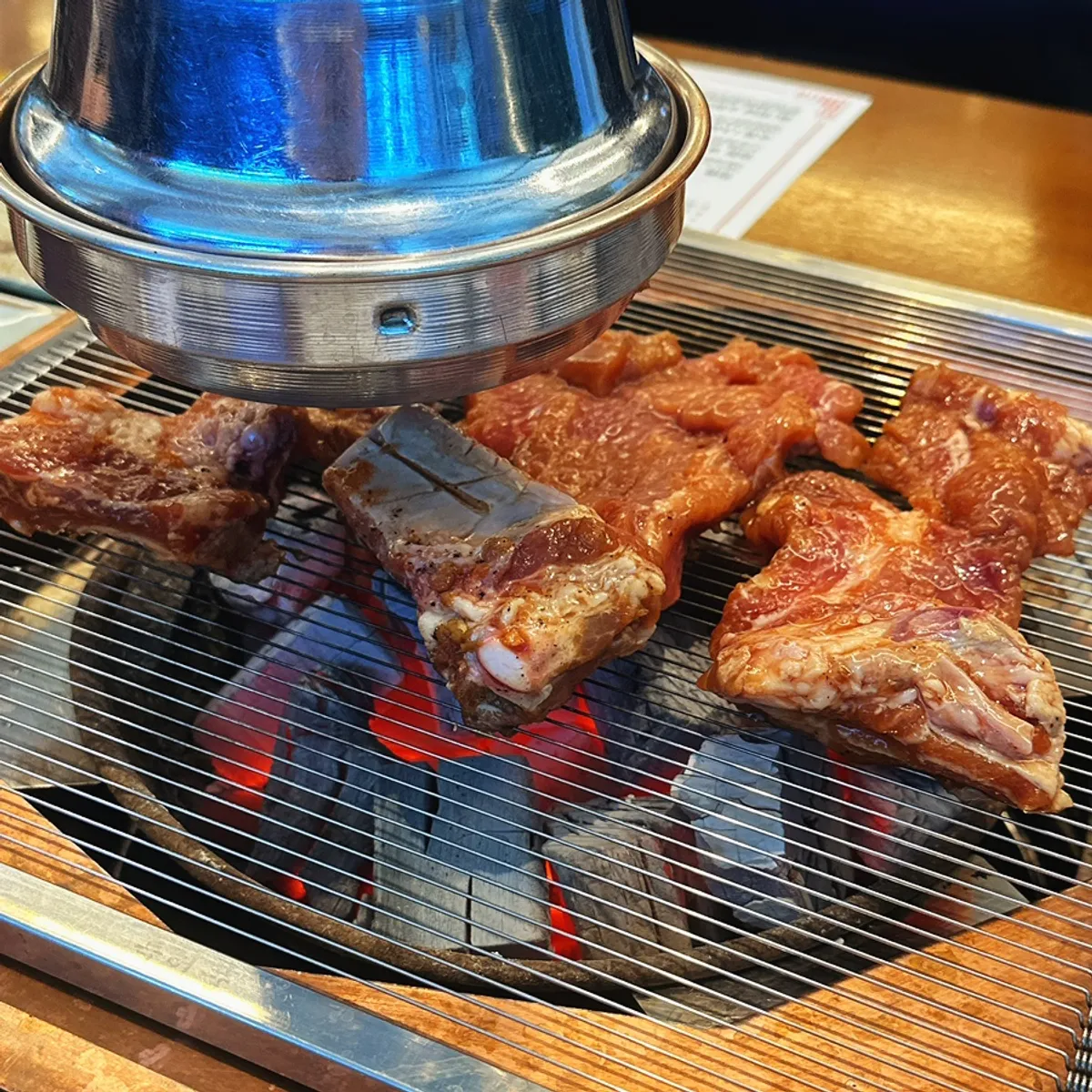 Pork galbi grilled while flipping to prevent burning