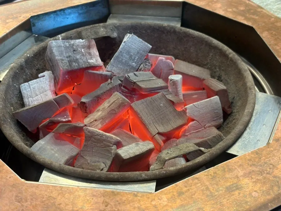 Fresh galbi grilling over charcoal