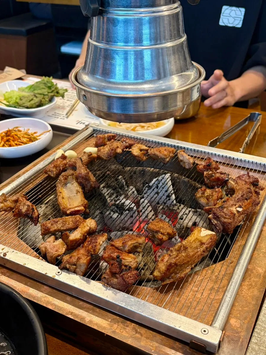 Handmade Korean pork galbi grilling to a golden brown