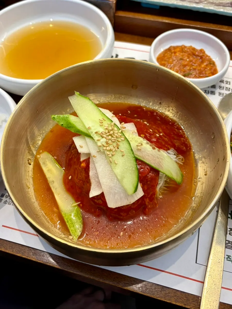 A bowl of complimentary bibim naengmyeon at Manpo Galbi
