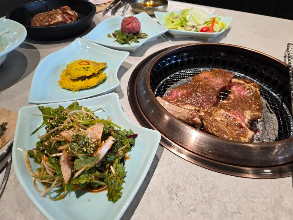 Seasoned pork galbi placed over the charcoal