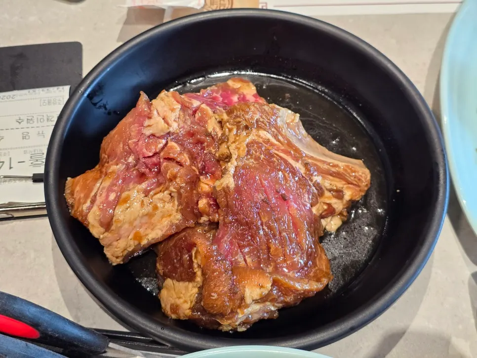 Seasoned galbi over glowing charcoal