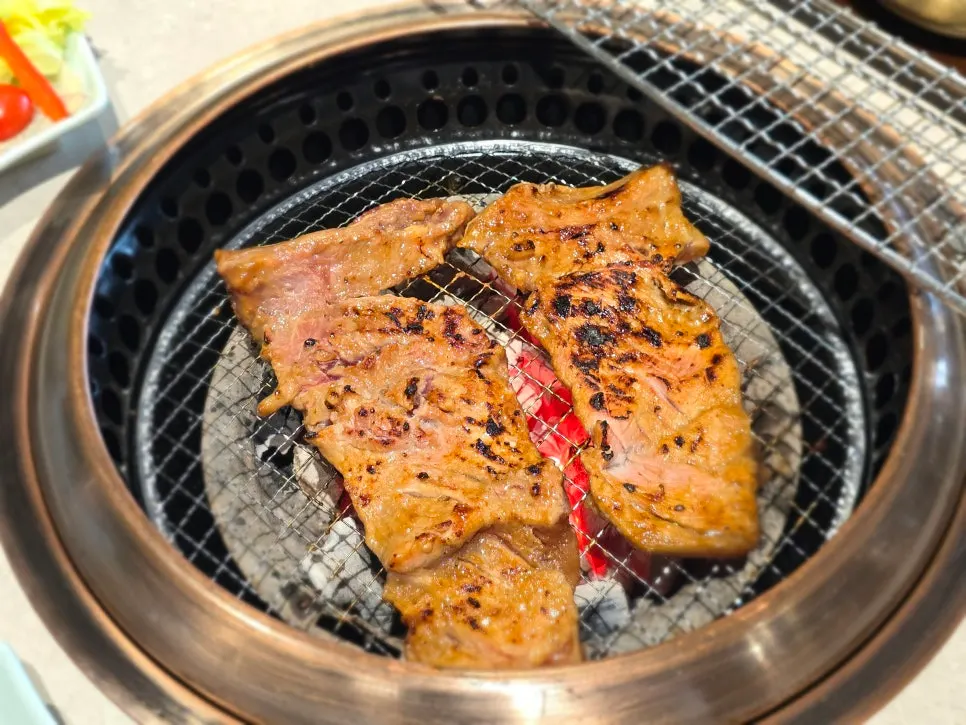 Seasoned galbi turning golden brown on the grill
