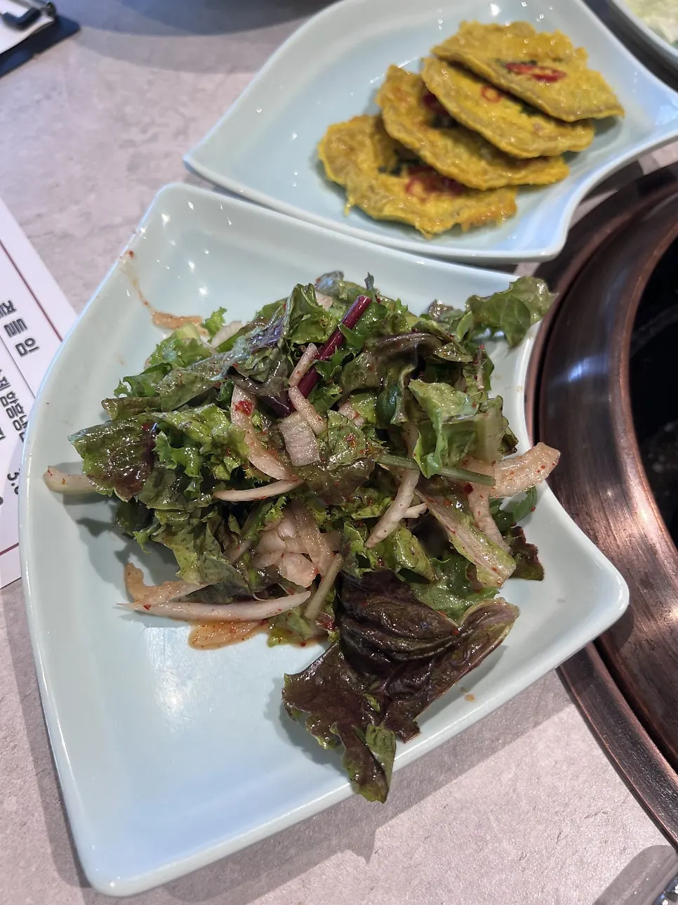 Free side dishes of yukhoe and yukjeon