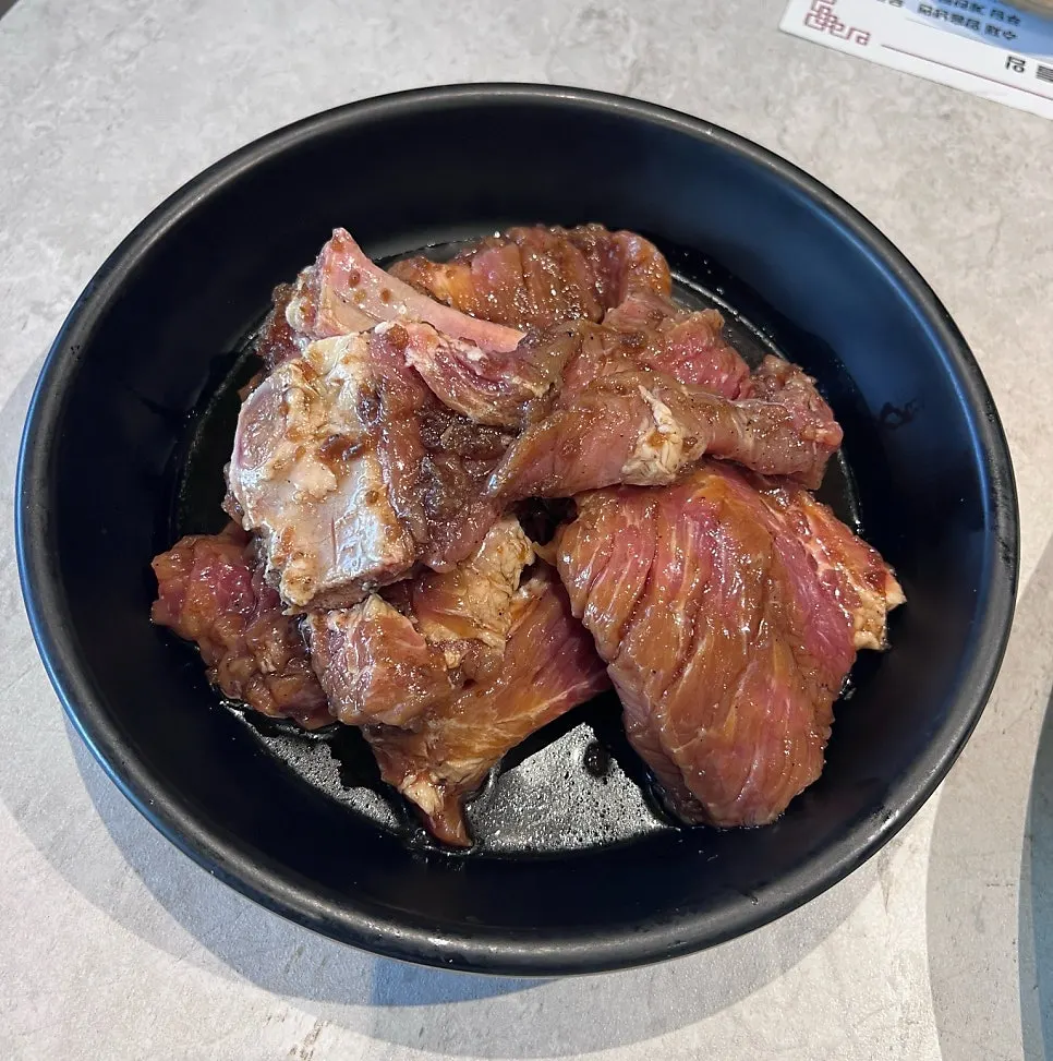 Plated 3-serving order of hand-cut pork galbi
