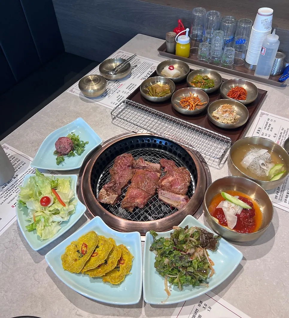 Full table spread with custom plates fitted to the round grill
