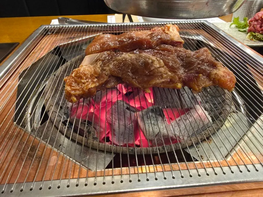 Handmade marinated ribs over charcoal