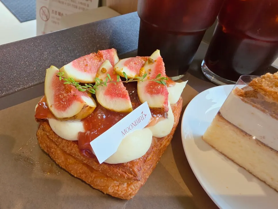 Tray with fig danish and iced Americano