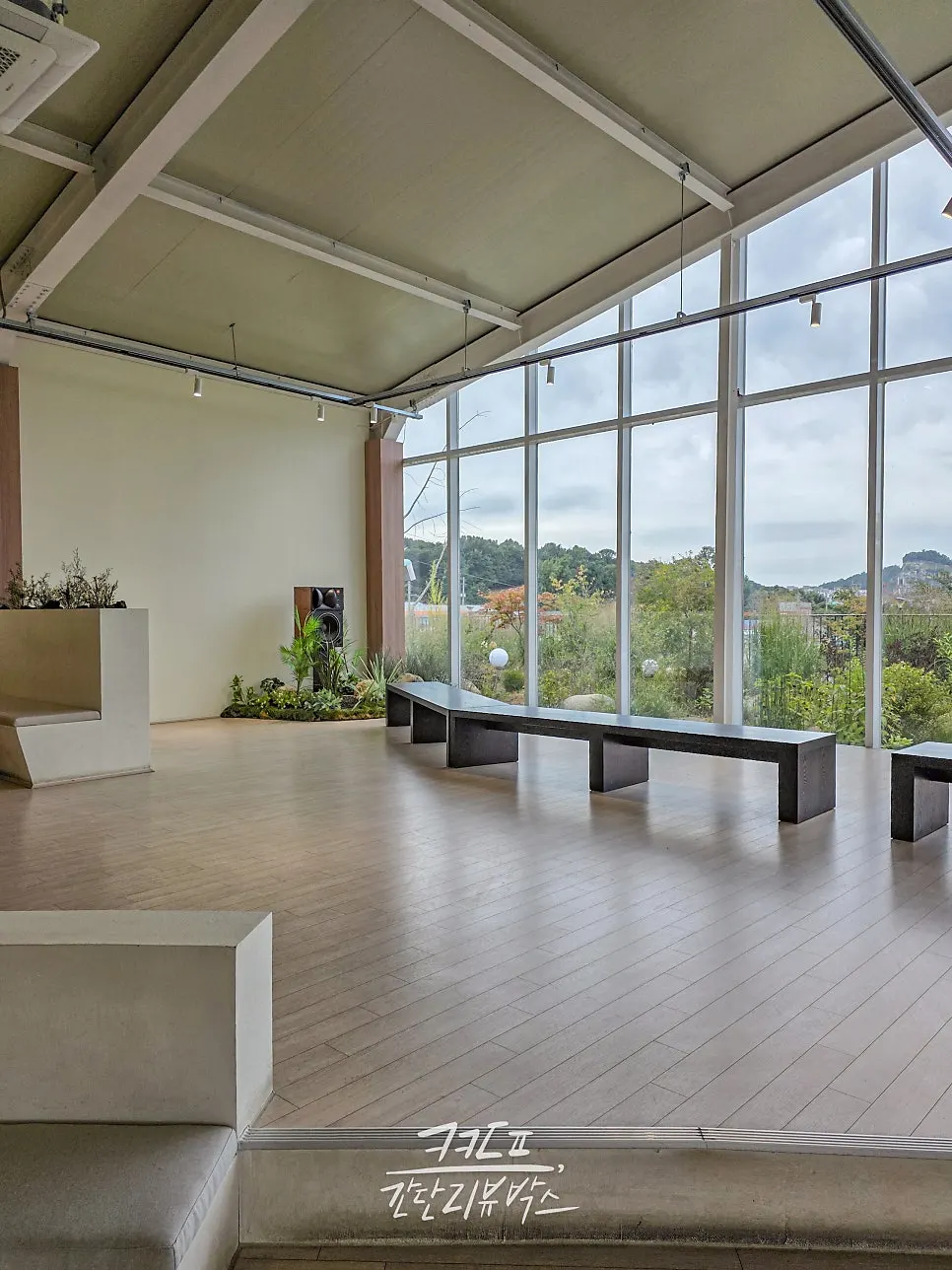 A sofa seat right in front of Moonbird's floor-to-ceiling window