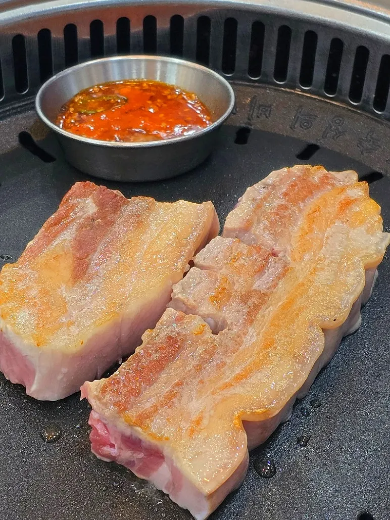 A piece of aged meat dipped in fermented anchovy sauce