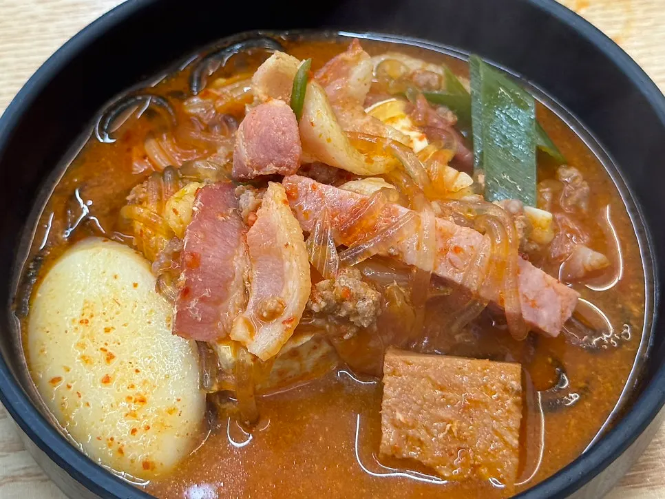 Budae-jjigae with added bacon topping