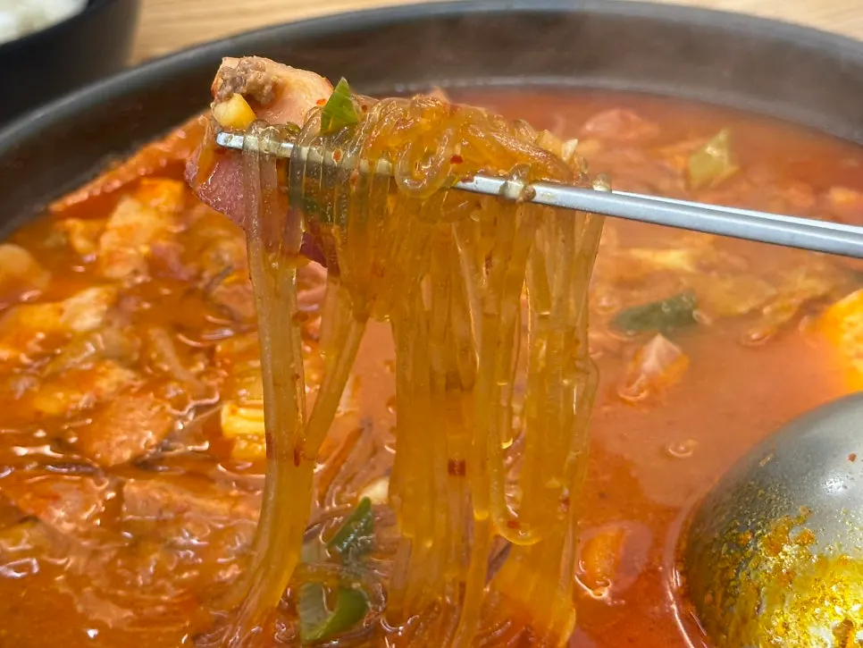 Budae-jjigae scooped onto a small plate