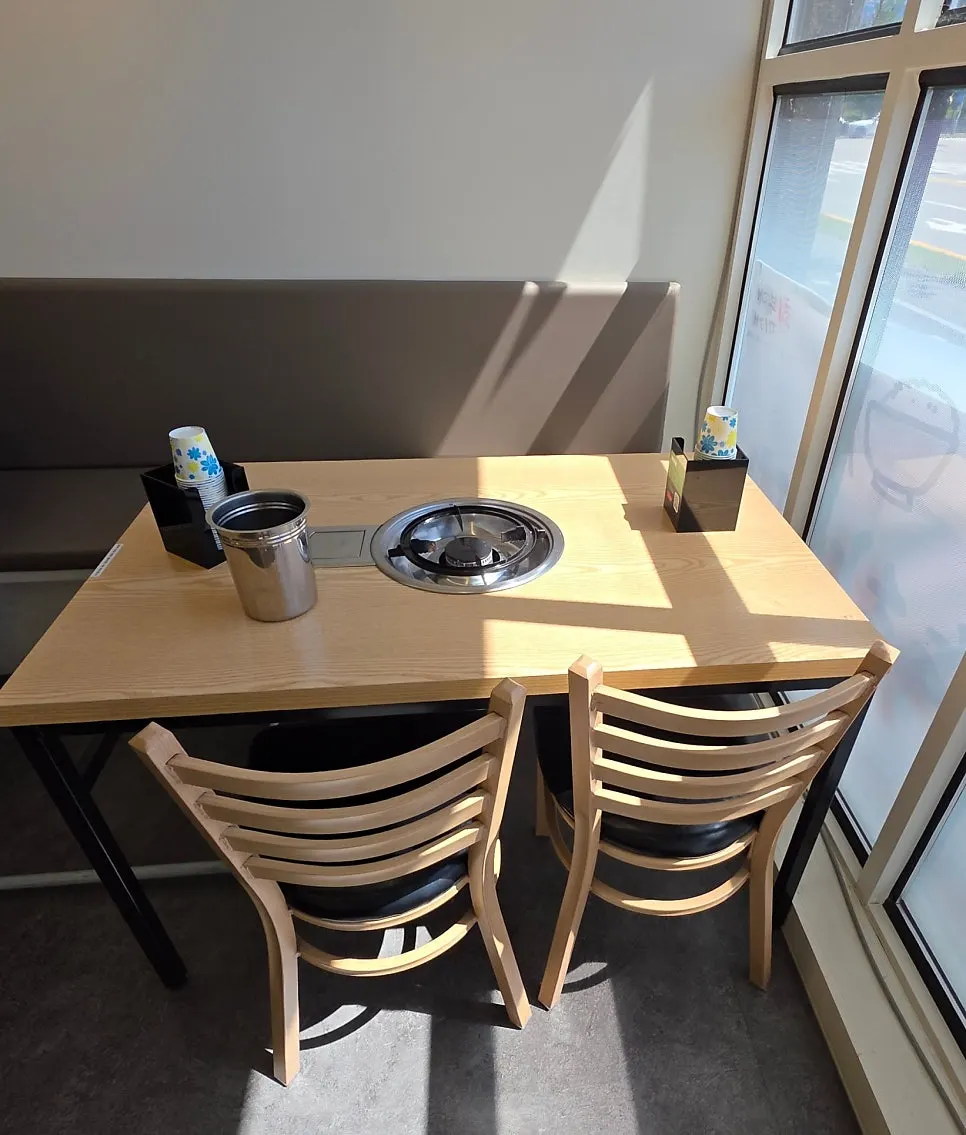 A corner of the restaurant with a baby chair