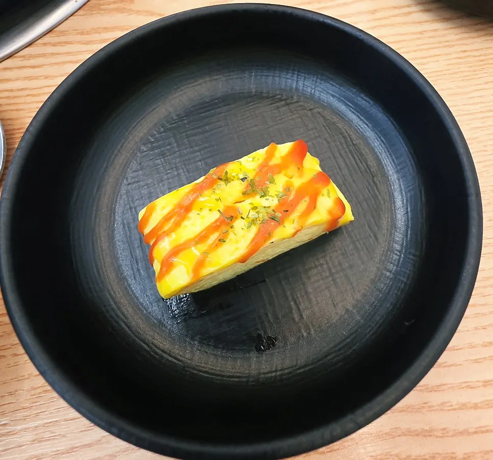 Picking up a piece of rolled egg