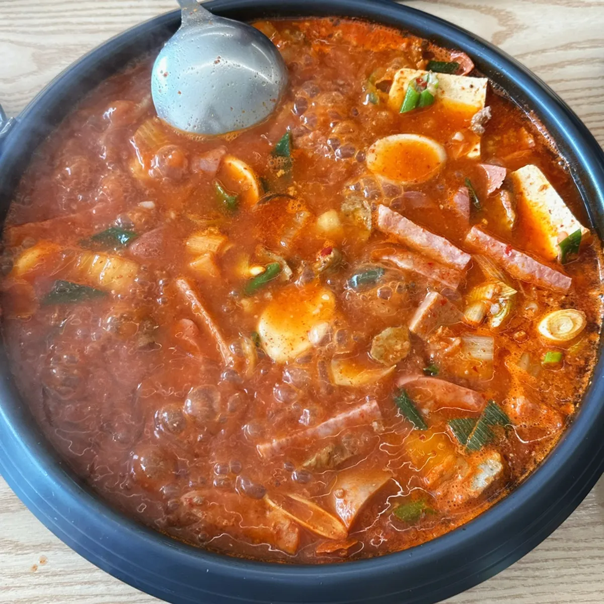 Budae-jjigae bubbling as it simmers