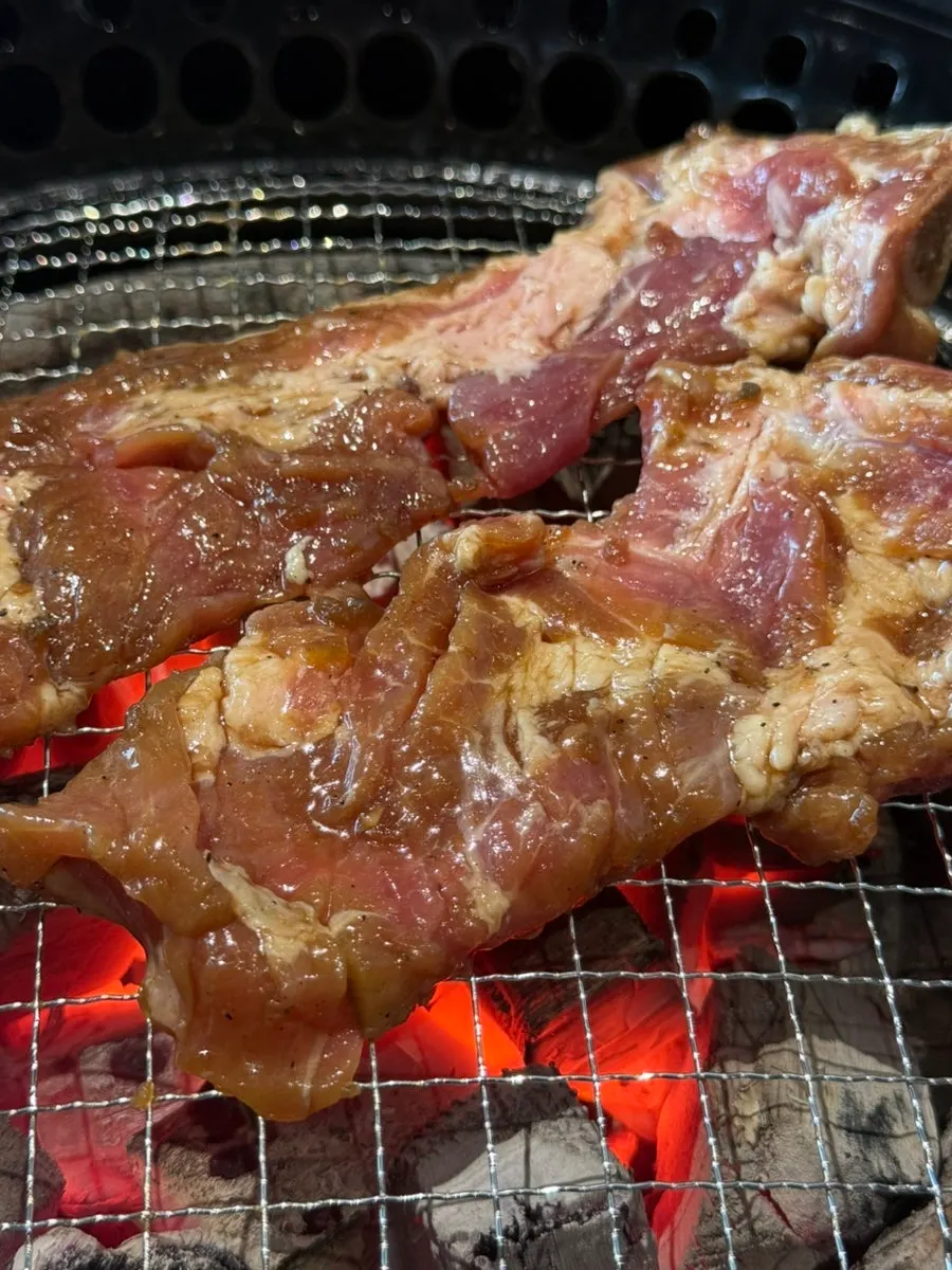 Marinated galbi and banchan laid out on the table
