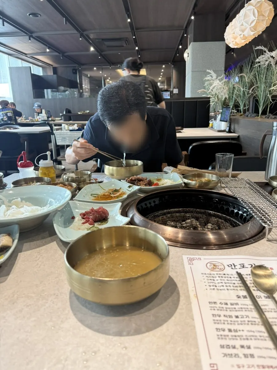 Interior seating and group tables at Manpo Garden