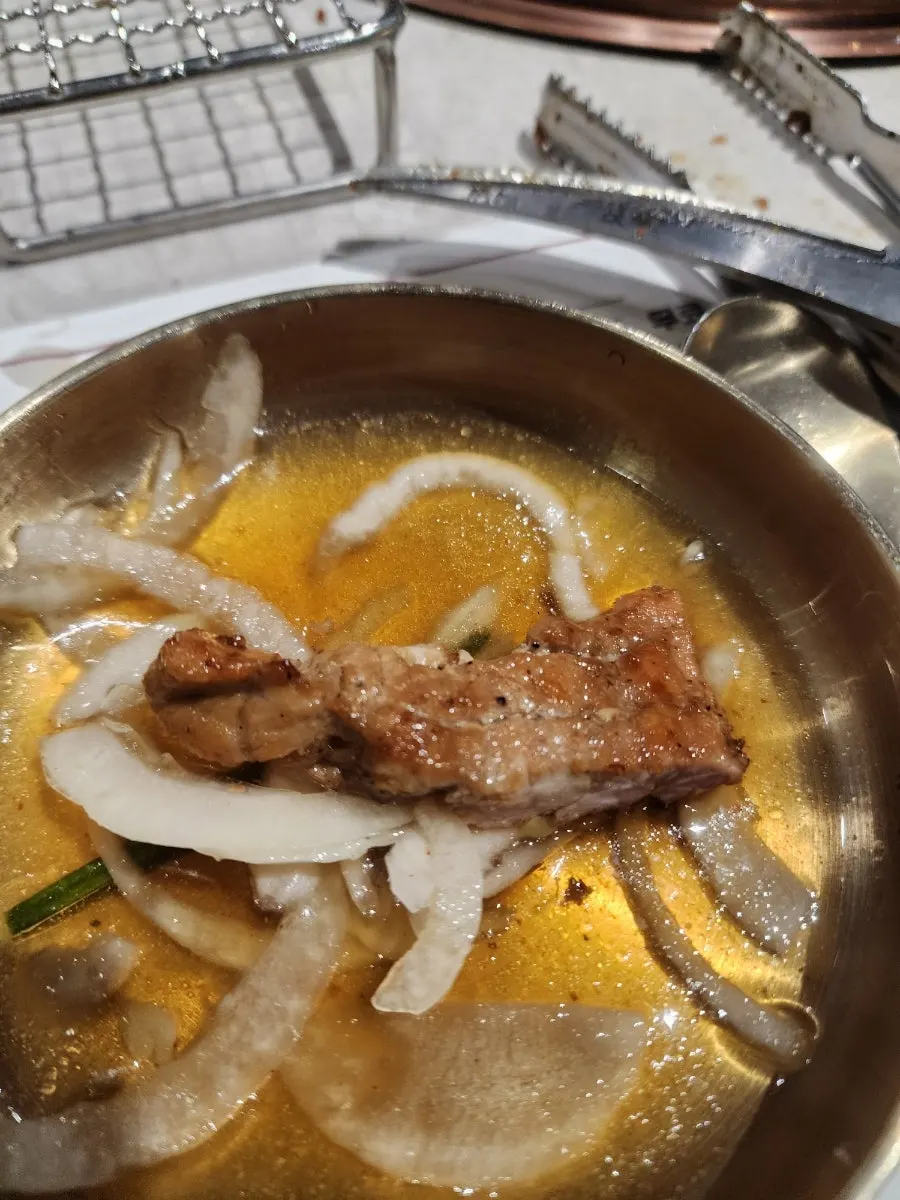 Grilled pork galbi served with side dishes