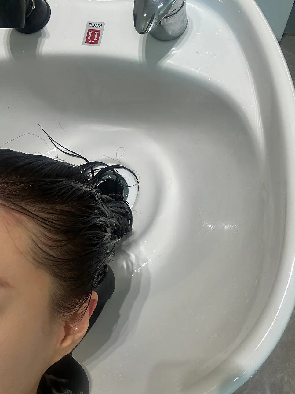 Clean wash room with a comfortable shampoo chair