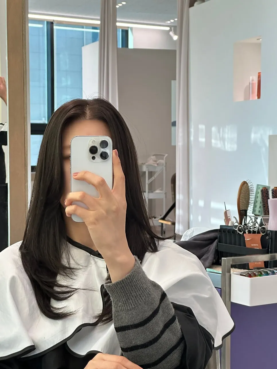 Finished tone-down ash brown colored hair