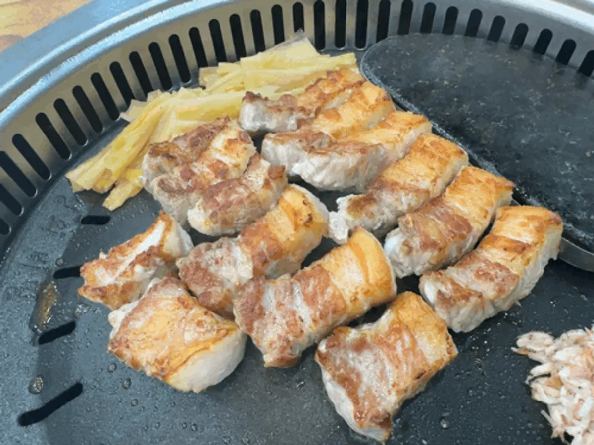 Aged pork belly grilled golden on the outside
