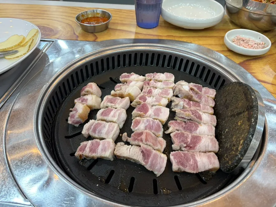 Close-up of pork belly cooking